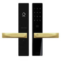 Black digital door lock with gold handles on a white background